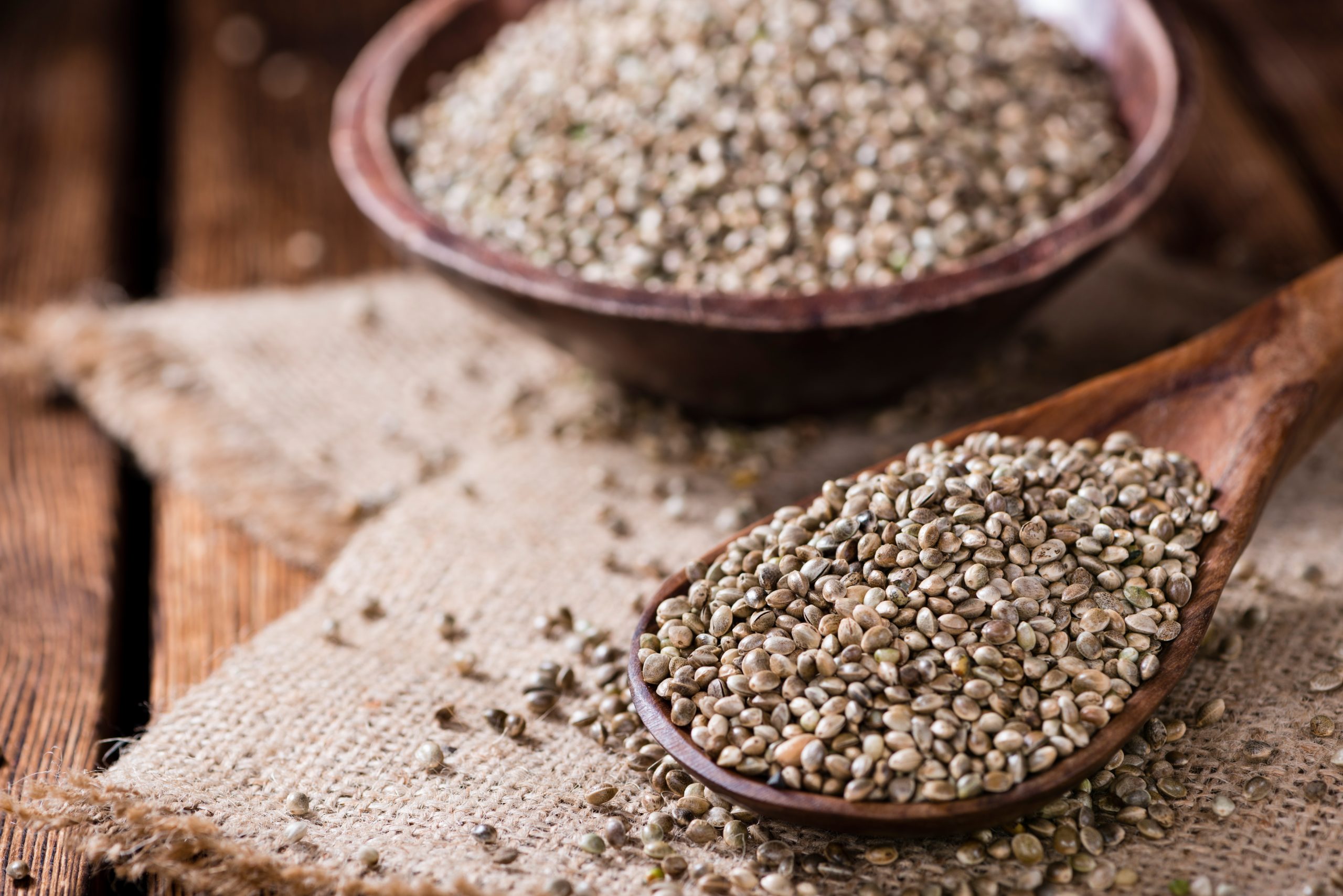 Portion,Of,Hemp,Seeds,(close-up,Shot),On,An,Old,Wooden