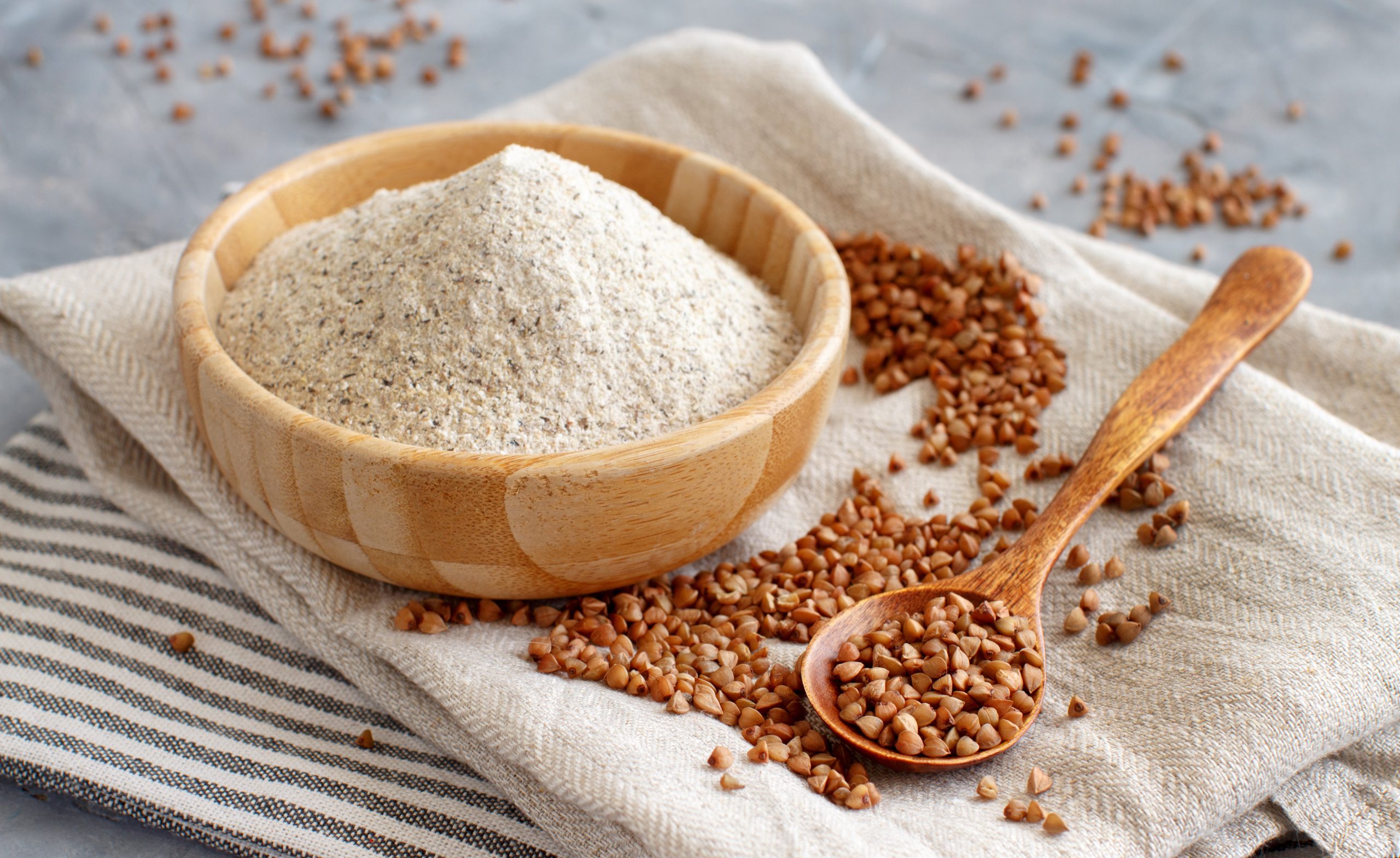 Buckwheat,Flour,In,A,Bowl,And,Buckwheat,Grain,In,A